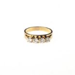 A DIAMOND RING bezel set with four brilliant-cut diamonds weighing approximately 0.80ct in total,