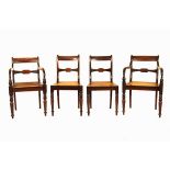 A SET OF TEN REGENCY MAHOGANY DINING CHAIRS comprising: 8 dining chairs and 2 carvers, each curved