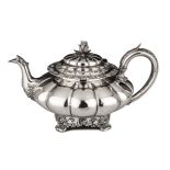 A GEORGE IV SILVER TEAPOT, ROSSITER & SONS, LONDON, 1829 the melon-shaped body with a flowerhead and