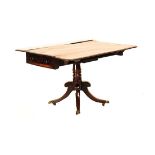 A REGENCY STYLE MAHOGANY PEMBROKE TABLE the rectangular top with hinged drop-sides above a frieze