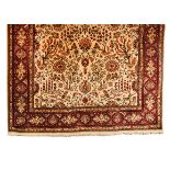 A TABRIZ CARPET, NORTH WEST PERSIA, MODERN the ivory field with an overall design of multi-