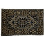 A HERIZ RUG, NORTH WEST PERSIA, circa 1930 the gold field with a stylised dark blue medallion,