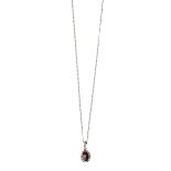 A GARNET & DIAMOND PENDANT AND CHAIN centred with an oval cut garnet weighing approximately 0.