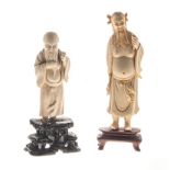 TWO CHINESE CARVED IVORY FIGURES OF IMMORTALS NOT SUITABLE FOR EXPORT each standing, wearing a loose