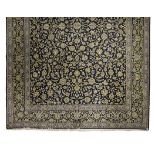 A KESHAN CARPET, PERSIA MODERN the black field with an all-over design of scrolling vines with