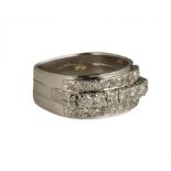 A DIAMOND RING the broad band of cable design, pave set to the centre with three rows of brilliant–