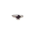 A DIAMOND RING centred with a claw-set round brilliant-cut Fancy Cognac diamond weighing 1,50cts,