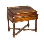 A CAPE STINKWOOD BIBLE DESK, 19TH CENTURY the hinged rectangular sloping lid enclosing compartments,