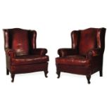 A PAIR OF MAHOGANY AND LEATHER-UPHOLSTERED WINGBACK ARMCHAIRS, 19TH CENTURY each padded back between