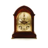 AN ENGLISH LANCET CASE BRACKET CLOCK a small solid mahogany mantel clock, having a lancet shaped