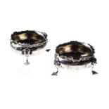 A PAIR OF VICTORIAN SILVER TABLE SALTS, HENRY HOLLAND, LONDON, 1868 each circular body with bright