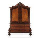 A CAPE STINKWOOD AND BEEFWOOD ARMOIRE, 19TH CENTURY the gabled pediment above a pair of panelled