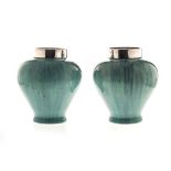 A PAIR OF ART DECO RUSKIN-STYLE SILVER-MOUNTED VASES, CIRCA 1918 each tapering ovoid body with