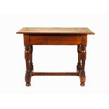A CAPE STINKWOOD TABLE, 19TH CENTURY the rectangular shaped top above a plain frieze drawer, on four