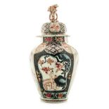 A JAPANESE IMARI OCTAGONAL VASE AND COVER, MEIJI, 1868-1912 the tapering ovoid body painted with