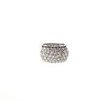 A DIAMOND CLUSTER RING pavé set with rows of round brilliant-cut diamonds weighing approximately 1,