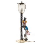 A MURANO GLASS CLOWN FIGURAL LAMP, 1950’s the clown steadying himself against a street lamp,