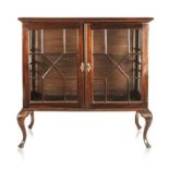 A CAPE STINKWOOD DISPLAY CABINET, LATE 19TH/EARLY 20TH CENTURY the rectangular top above a pair