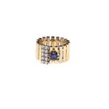 A IOLITE AND DIAMOND RING set with a square-cut iolite highlighted by ten brilliant-cut diamonds