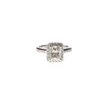 A DIAMOND RING centred with a radiant–cut diamond weighing 2.098cts, the conforming surround and