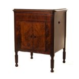 A GILBERT WALNUT CASED GRAMOPHONE CABINET, CIRCA 1930 the hinged rectangular shaped top enclosing