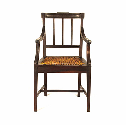 A CAPE STINKWOOD ARMCHAIR, 19TH CENTURY the curved top-rail above a conforming mid-rail,