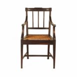 A CAPE STINKWOOD ARMCHAIR, 19TH CENTURY the curved top-rail above a conforming mid-rail,