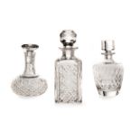 A MISCELLANEOUS GROUP OF THREE CUT-CRYSTAL DECANTERS AND STOPPERS, 20th CENTURY in various shapes