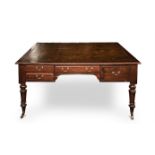 AN EDWARDIAN MAHOGANY WRITING TABLE the rectangular moulded top with a gilt–tooled leather inset