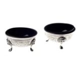 A PAIR OF VICTORIAN SILVER TABLE SALTS, MAKER TM, LONDON, 1883 each circular body with bright cut