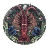 A PALISSY STYLE CALDAS DA RAINHA 'MAJOLICA' LOBSTER DISH, CIRCA 1920 the circular dish with a