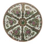 A SOUTH EAST ASIAN FAMILLE ROSE CHARGER painted with radiating panels enclosing birds and