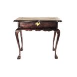 A CAPE STINKWOOD LOW TABLE, 19TH CENTURY the rectangular shaped top above a frieze drawer, wavy