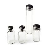 A SET OF FOUR EDWARDIAN SILVER-MOUNTED GLASS SCENT BOTTLES, MAKER P W, LONDON, 1908 each of