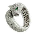 A DIAMOND RING after the Panthère design, modeled in the form of a stylized panther, embellished