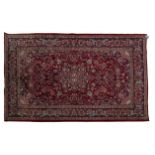 A KESHAN CARPET, PERSIA, MODERN the red field with a blue medallion, similar spandrels all with