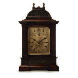 AN VICTORIAN OAK CASED EIGHT DAY BRACKET CLOCK the case mounted with two finials, an arched dome,