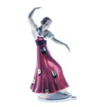 A ROYAL DUX FIGURINE OF A DANCER, CIRCA 1930 modelled with one arm raised over her head, the other