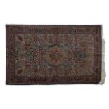 A SAROUK RUG, WEST PERSIA, circa 1950 the sea green field with an ivory floral medallion all with