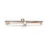 A DIAMOND AND PEARL BAR BROOCH claw set with an old-cut diamond weighing approximately 0.42cts and