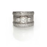 A DIAMOND RING centred with a box-set old-cut diamond weighing approximately 0.75cts, flanked on