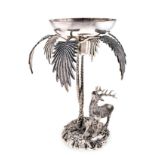A SPANISH ELECTROPLATE CENTREPIECE, VALENTI depicting a stag standing beneath two palm trees