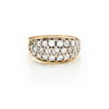 A DIAMOND RING centred with a panel of three rows of brilliant-cut diamonds, graduated in size,