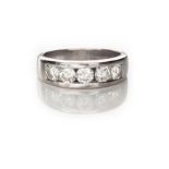 A DIAMOND HALF-ETERNITY RING channel set to the centre with a row of five brilliant-cut diamonds