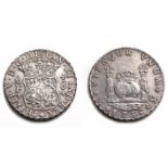 A MEXICAN EIGHT REALES SILVER COIN, 1736 crowned globes flanked by crowned pillars with banner, date