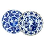 TWO DUTCH DELFT BLUE AND WHITE PLATES, 18TH CENTURY one centrally painted with foliage issuing