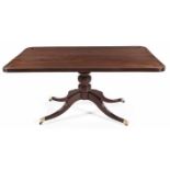 A REGENCY MAHOGANY BREAKFAST TABLE the rectangular top with reeded frieze, on a turned support, on