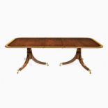 A REGENCY STYLE MAHOGANY EXTENDING DINING TABLE RETAILED BY JOHN PLUMMER, LONDON each rectangular