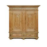 A DUTCH OAK KUSSENKAS the outswept cornice above a carved frieze, a pair of carved panelled doors