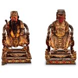 A PAIR OF CHINESE POLYCHROME AND PARCEL-GILT CARVED WOODEN FIGURES OF AN EMPEROR AND EMPRESS each